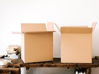 Cardboard boxes on a wooden table for organizing household items