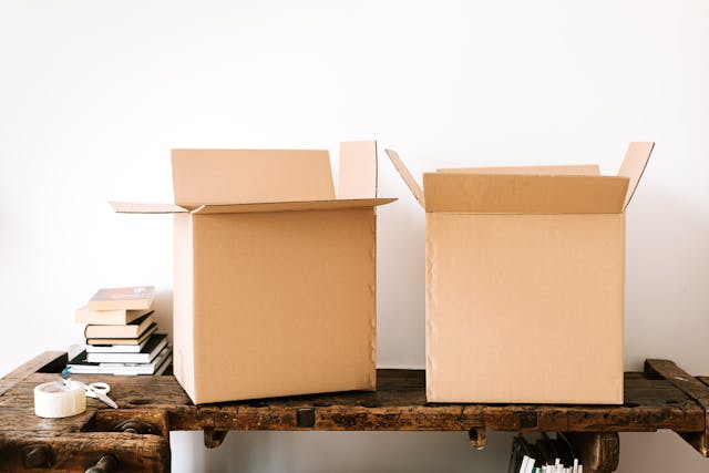 Cardboard boxes on a wooden table for organizing household items