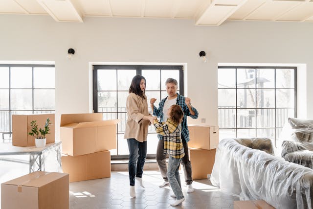 Parents with their son in a new home